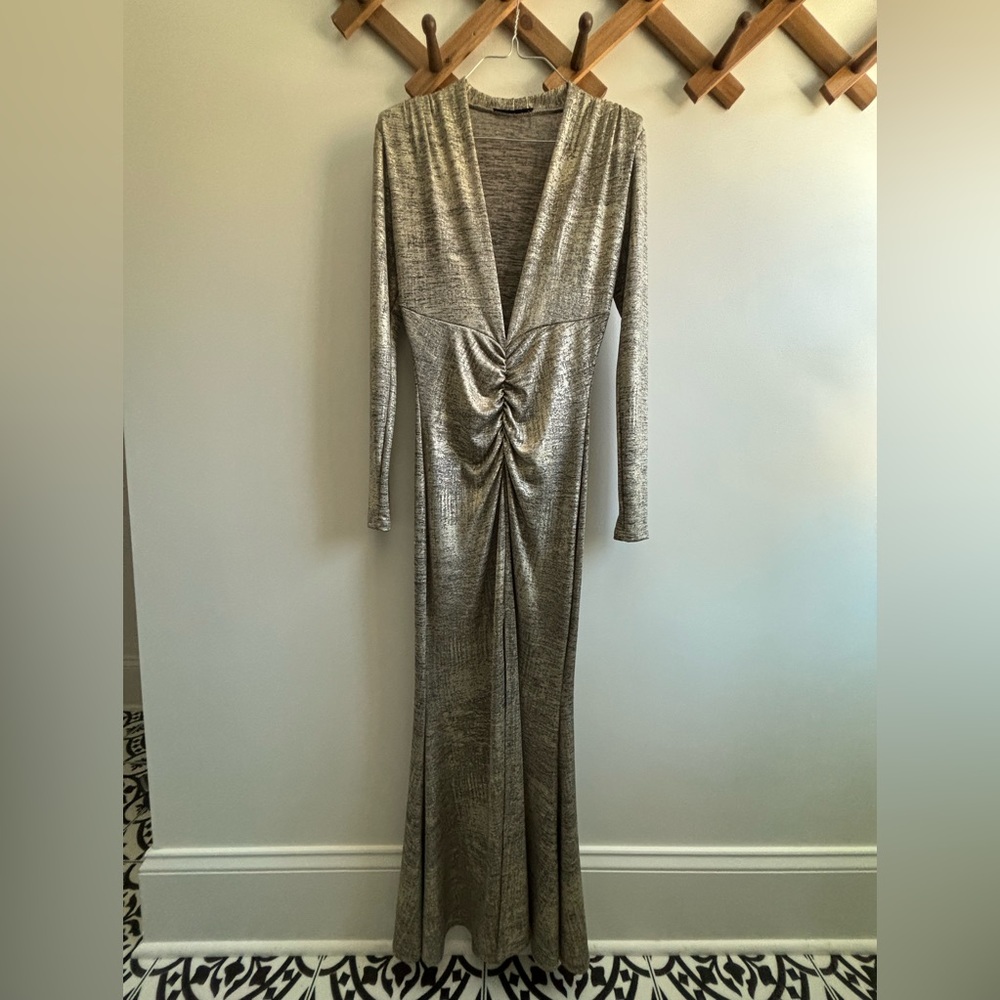 Gold long dress. Deep V front. 5ft tall and wore heels. Body con.